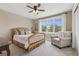 Comfortable bedroom with a cozy armchair, natural light, and a calming color palette at 81 Falcon Hills Dr, Highlands Ranch, CO 80126