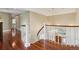 Elegant foyer with curved staircase, wood floors, and chandelier lighting at 81 Falcon Hills Dr, Highlands Ranch, CO 80126