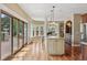 Spacious kitchen and breakfast nook with wood floors and lots of natural light at 81 Falcon Hills Dr, Highlands Ranch, CO 80126