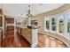 Bright, open kitchen with a large island, hardwood floors, and plenty of natural light at 81 Falcon Hills Dr, Highlands Ranch, CO 80126