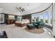 Spacious main bedroom with large windows, a king-size bed, and elegant furnishings at 81 Falcon Hills Dr, Highlands Ranch, CO 80126