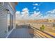 Private balcony with views of the surrounding neighborhood and blue skies at 10124 Xanadu St, Commerce City, CO 80022