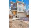 Charming two-story home with a two-car garage and a well-manicured front yard at 10124 Xanadu St, Commerce City, CO 80022