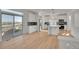 Modern kitchen featuring stainless steel appliances, bright white cabinets, and a kitchen island at 10124 Xanadu St, Commerce City, CO 80022