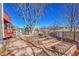 Landscaped backyard featuring a wooden deck and raised garden beds in a fenced yard at 12356 Wolff Dr, Broomfield, CO 80020