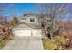 Charming two-story home boasts a three-car garage, solar panels, landscaped yard, and inviting curb appeal at 12356 Wolff Dr, Broomfield, CO 80020