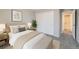 Bedroom with sliding closet doors and carpeted floors, decorated with neutral tones and natural accents at 2538 Central Park Boulevard, Denver, CO 80238