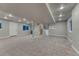 Spacious finished basement with carpet, recessed lights and stairs leading upstairs at 6550 W 74Th Pl, Arvada, CO 80003
