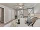 Cozy bedroom with an ensuite bathroom and multiple storage options at 6550 W 74Th Pl, Arvada, CO 80003