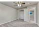 Bedroom featuring neutral colors, carpeted floor and view to the ensuite bathroom at 6550 W 74Th Pl, Arvada, CO 80003