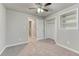Bedroom featuring neutral colors, carpeted floor and view to the ensuite bathroom at 6550 W 74Th Pl, Arvada, CO 80003