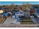 Charming home with a well-manicured lawn, inviting front porch, and a neatly paved driveway at 6550 W 74Th Pl, Arvada, CO 80003