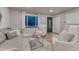 Elegant living room featuring hardwood floors, contemporary decor, and ample natural light at 6550 W 74Th Pl, Arvada, CO 80003