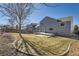 View of a large fenced in backyard with a grey home featuring white trim at 11042 Blackwolf Ln, Parker, CO 80138