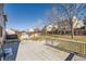 Fenced backyard with a large wooden deck and well manicured lawn at 11042 Blackwolf Ln, Parker, CO 80138
