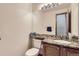 Powder room featuring modern vanity with granite countertop, tile backsplash, and stylish decor at 11042 Blackwolf Ln, Parker, CO 80138