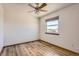 Comfortable bedroom features wood-look flooring, a window, and plenty of natural light at 11042 Blackwolf Ln, Parker, CO 80138