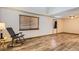 Bedroom with wood floors, a window with blinds, and ample natural light at 11042 Blackwolf Ln, Parker, CO 80138