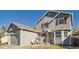 View of the home's exterior, showcasing the siding, roofline, and landscaping at 11042 Blackwolf Ln, Parker, CO 80138