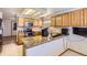 Kitchen with wood cabinets, granite countertops, stainless steel appliances, and lots of natural light at 11042 Blackwolf Ln, Parker, CO 80138