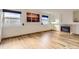 Bright living room featuring hardwood floors, a fireplace and dual windows for ample light at 11042 Blackwolf Ln, Parker, CO 80138