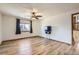 Bright living room boasting wood-look flooring, fan, and natural light from large window at 11042 Blackwolf Ln, Parker, CO 80138
