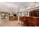 Finished basement featuring a built-in bar, lounge area, and walk-out access to the backyard at 10227 Osceola Ct, Westminster, CO 80031
