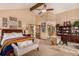 Spacious primary bedroom with vaulted ceiling and a seating area at 10227 Osceola Ct, Westminster, CO 80031