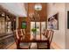 Formal dining room with a long wooden table and elegant chandelier at 10227 Osceola Ct, Westminster, CO 80031