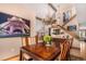 Elegant dining room featuring hardwood floors, a chandelier, and an Eiffel Tower art piece at 10227 Osceola Ct, Westminster, CO 80031