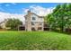 Expansive backyard view featuring a multi-level deck and lush green lawn at 10227 Osceola Ct, Westminster, CO 80031