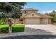 Two-story home with a three-car garage, brick accents, manicured lawn, and a large tree at 10227 Osceola Ct, Westminster, CO 80031