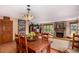 Comfortable living area with fireplace, wood floors, and dining area at 10227 Osceola Ct, Westminster, CO 80031