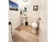 Powder room featuring a pedestal sink, modern fixtures, and wood-style flooring at 5492 Woodroot Pt, Castle Rock, CO 80104