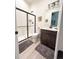 Modern bathroom features a glass shower and elegant vanity with decor at 5492 Woodroot Pt, Castle Rock, CO 80104