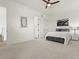 Spacious bedroom with neutral walls, a bed, and a ceiling fan offering comfortable and relaxing ambiance at 5492 Woodroot Pt, Castle Rock, CO 80104