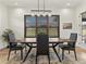 Dining room with a large window offering natural light, and a view of the outdoors at 5492 Woodroot Pt, Castle Rock, CO 80104