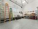 Well-organized garage featuring epoxy flooring, a work bench, and ample storage at 5492 Woodroot Pt, Castle Rock, CO 80104