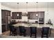 Gourmet kitchen with a large island, granite countertops, and stainless steel appliances at 5492 Woodroot Pt, Castle Rock, CO 80104