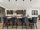 Beautiful kitchen featuring a central island, stainless steel appliances, and sleek design at 5492 Woodroot Pt, Castle Rock, CO 80104