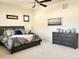 Comfortable primary bedroom with a ceiling fan, soft carpet, and neutral paint at 5492 Woodroot Pt, Castle Rock, CO 80104
