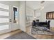 Bright home office space with modern desk, stylish rug, and large windows at 5492 Woodroot Pt, Castle Rock, CO 80104