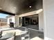 Outdoor patio featuring a built-in grill and a sliding door to the living room at 5492 Woodroot Pt, Castle Rock, CO 80104