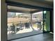 Covered patio with outdoor seating and a grill, overlooking a fenced yard with mature trees at 5492 Woodroot Pt, Castle Rock, CO 80104