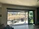 Covered patio with outdoor furniture and grill, offering a view of the surrounding landscape at 5492 Woodroot Pt, Castle Rock, CO 80104