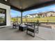 Covered patio featuring comfortable seating and scenic views of the community at 5492 Woodroot Pt, Castle Rock, CO 80104