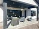 Cozy outdoor patio featuring a barbecue grill and comfortable seating area, ideal for relaxing and enjoying the backyard at 5492 Woodroot Pt, Castle Rock, CO 80104
