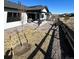 The landscaped backyard features a covered patio and decorative gravel, perfect for outdoor activities and relaxing at 5492 Woodroot Pt, Castle Rock, CO 80104