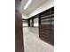 Spacious walk-in closet with custom shelving and drawers for optimal storage and organization at 5492 Woodroot Pt, Castle Rock, CO 80104