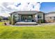 Expansive backyard with lush lawn and a patio at 26722 E Peakview Pl, Aurora, CO 80016